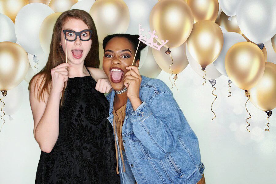 2 Girls Taking Picture from Selfie Booth