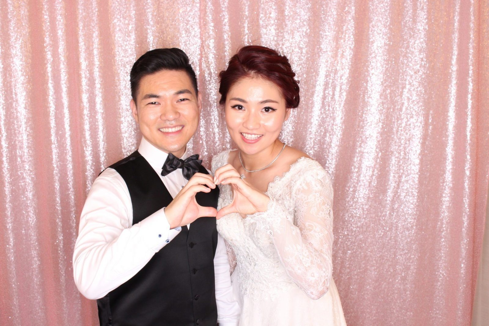 Bride & Groom Taking Selfie From Photobooth